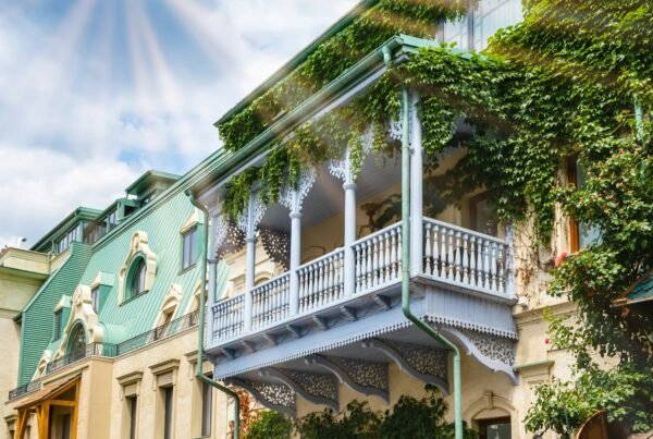 Carved wooden balcony and colorful buildings in historical Tbilisi, Georgia