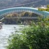 Defocused background with the Peace Bridge in Tbilisi over the Kura River.